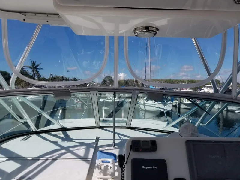 Slide: The Image of 2006 Stamas 320 Express boat interior with clear view of marina and blue sky. - 13