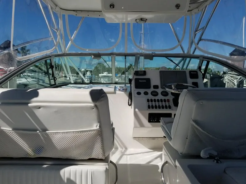 Slide: The Image of 2006 Stamas 320 Express boat cockpit with dual seats and control panel. - 16