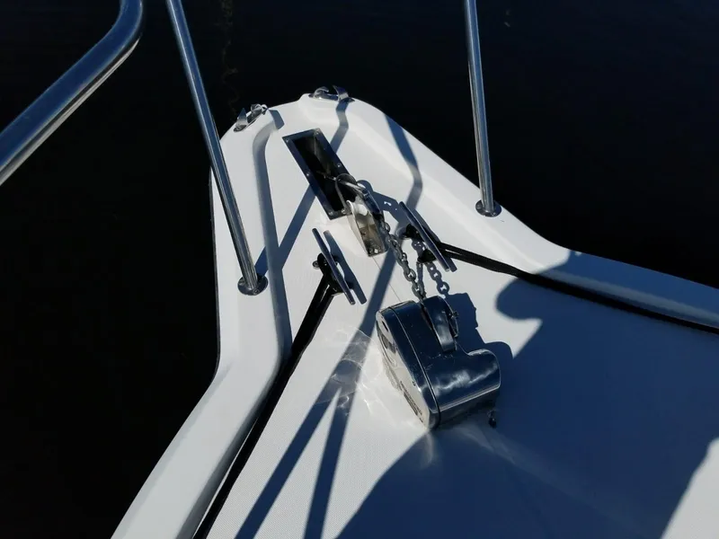 Slide: The Image of Bow of 2006 Stamas 320 Express boat with anchor chain and railing. - 23