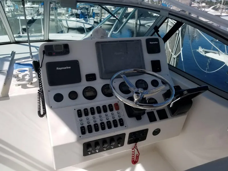 Slide: The Image of Helm of 2006 Stamas 320 Express boat with navigation controls and steering wheel. - 25