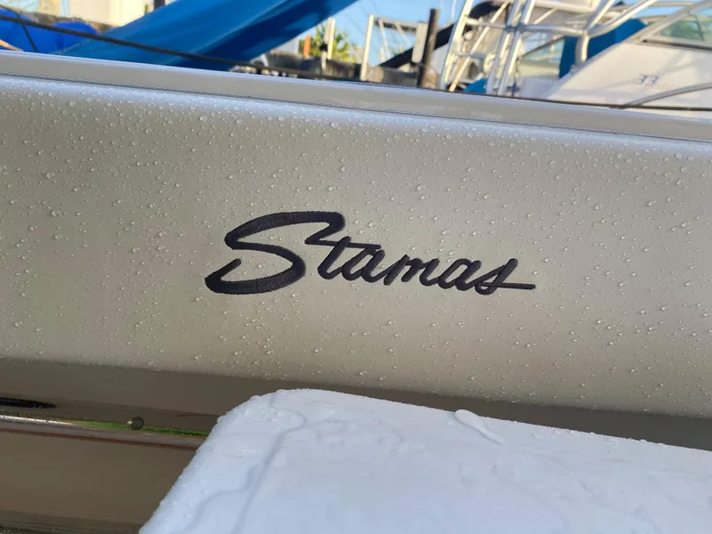 Slide: The Image of Close-up of 2006 Stamas 320 Express boat logo with water droplets. - 5