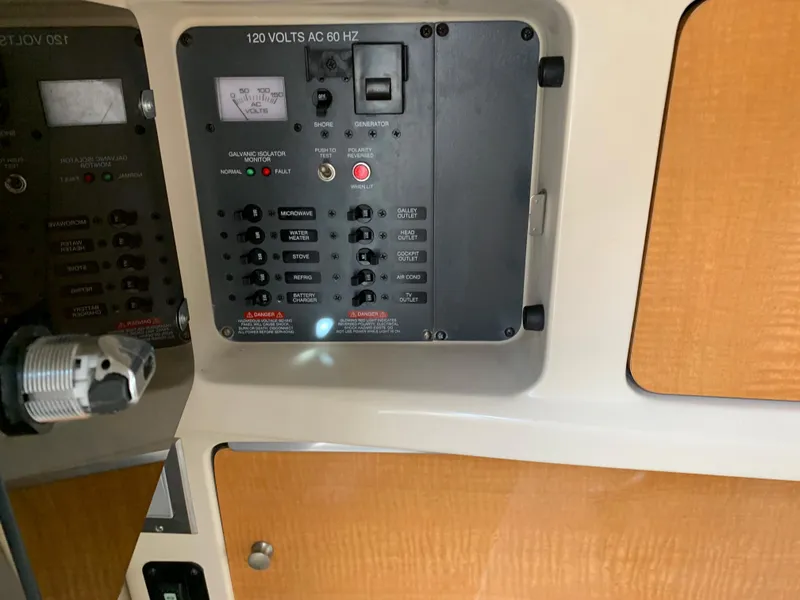 Slide: The Image of Electrical control panel of a 2006 Chaparral 276 Signature boat. - 17