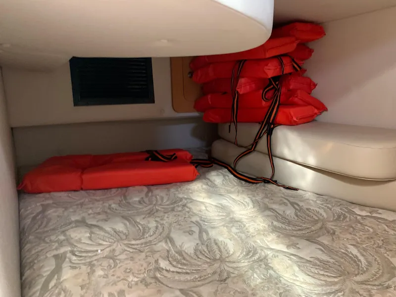 Slide: The Image of 2006 Chaparral 276 Signature cabin with life jackets and bedding. - 19
