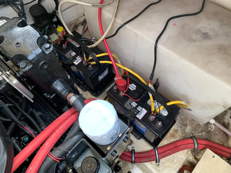 Slide: The Image of Engine compartment of a 2006 Chaparral 276 Signature boat with batteries and wiring. - 24