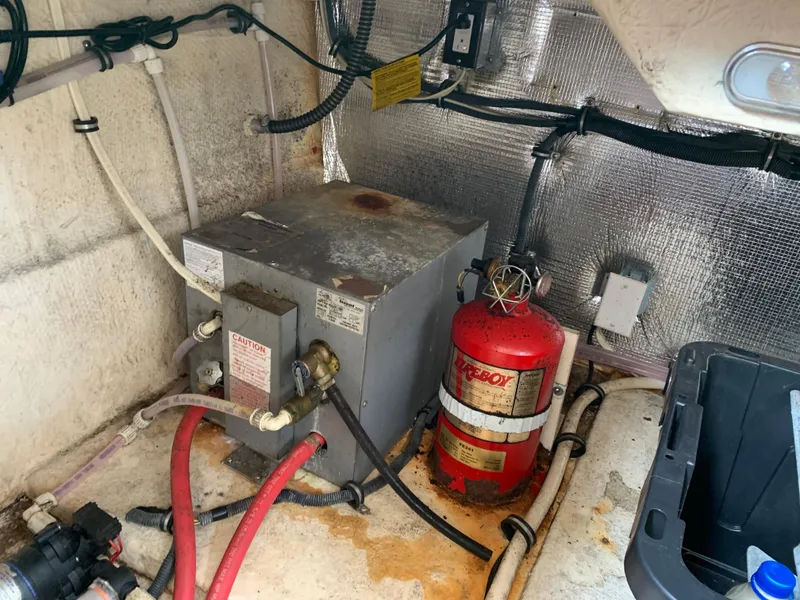 Slide: The Image of 2006 Chaparral 276 Signature engine compartment with fire extinguisher and equipment. - 25