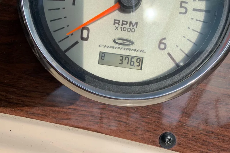 Slide: The Image of Close-up of 2006 Chaparral 276 Signature RPM gauge showing 376.9 hours. - 27