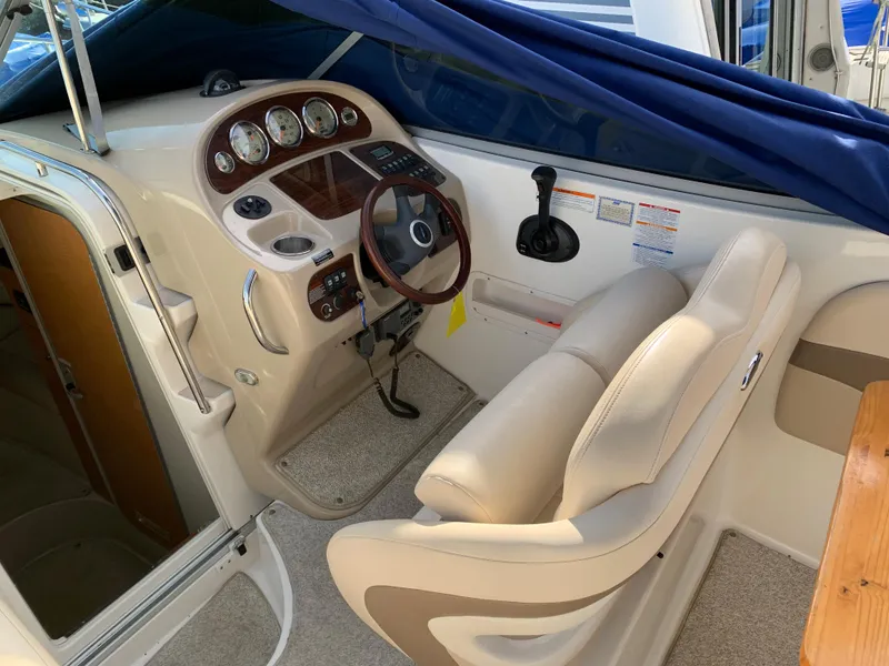 Slide: The Image of 2006 Chaparral 276 Signature boat cockpit with steering wheel and control panel. - 9