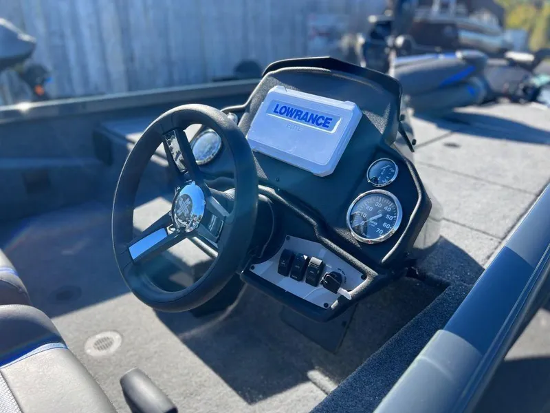 Slide: The Image of 2023 Ranger RT198P boat dashboard with Lowrance electronics and steering wheel. - 3