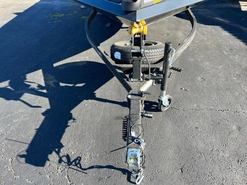 Slide: The Image of 2023 Ranger RT198P trailer hitch with spare tire on asphalt. - 5