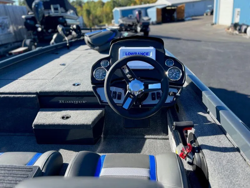 Slide: The Image of 2023 Ranger RT198P boat interior with steering wheel and Lowrance display. - 7