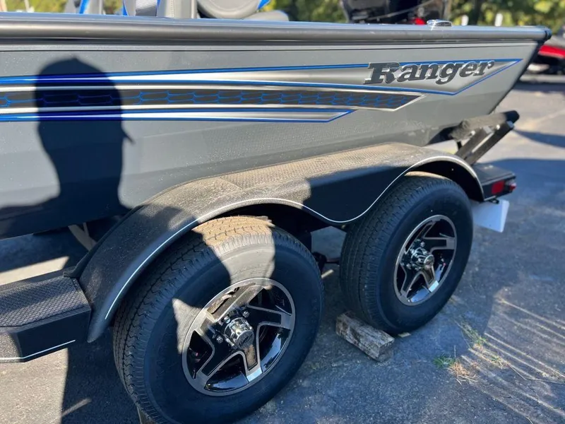 Slide: The Image of 2023 Ranger RT198P boat trailer with dual wheels and sleek design. - 8