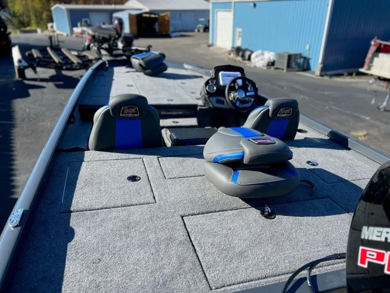 Slide: The Image of 2023 Ranger RT198P fishing boat with spacious deck and modern seating. - 9