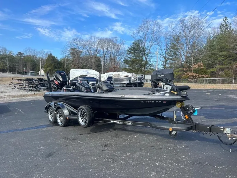 Slide: The Image of 2014 Ranger Z520C fishing boat on trailer in parking lot. - 2