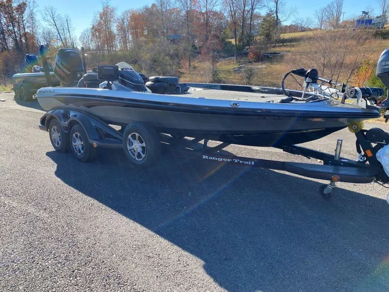 The Image of 2014 Ranger Z520C bass boat on trailer in sunny outdoor setting. - 0
