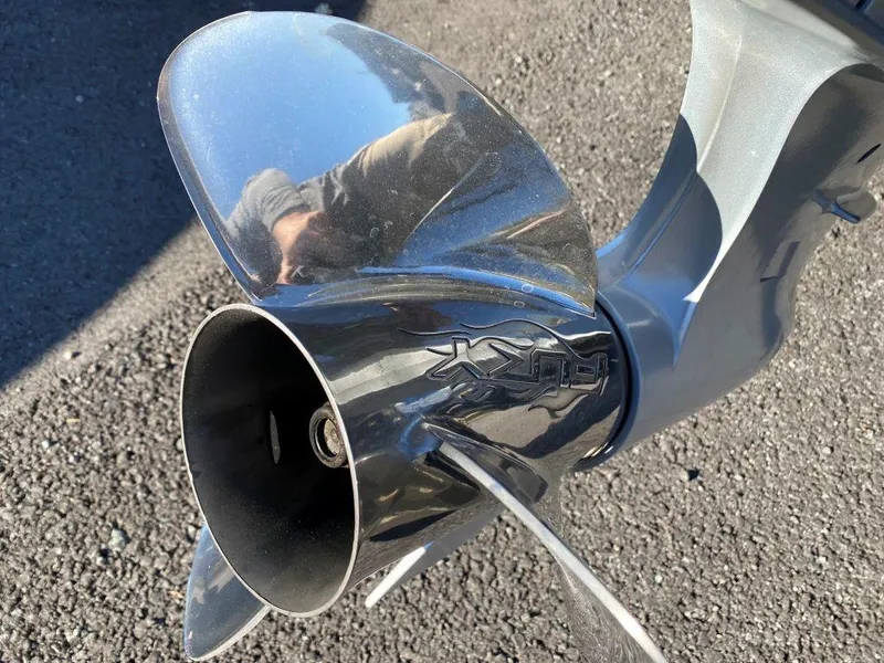 Slide: The Image of Close-up of a 2014 Ranger Z520C boat propeller on asphalt. - 12