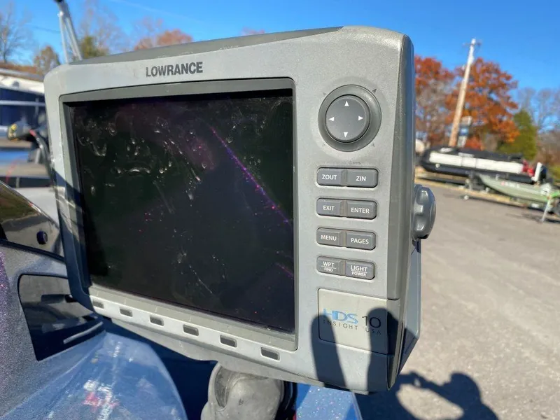Slide: The Image of Lowrance fishfinder on 2014 Ranger Z520C boat, outdoor setting with autumn trees. - 18