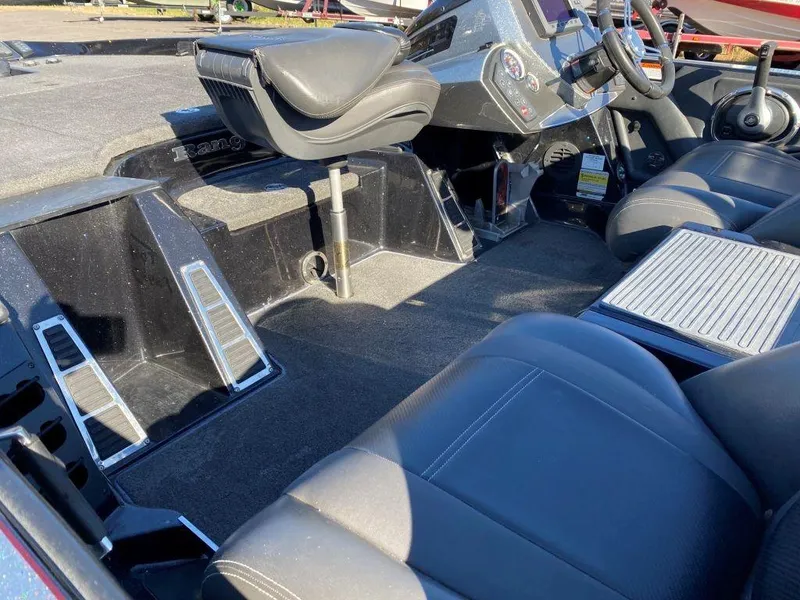 Slide: The Image of 2014 Ranger Z520C boat interior with seating and steering console. - 7