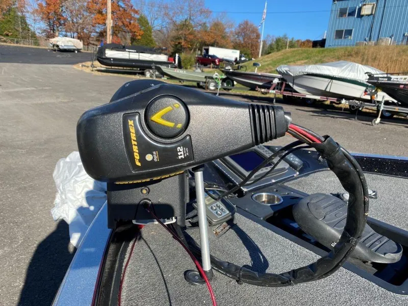 Slide: The Image of 2014 Ranger Z520C boat with Fortrex trolling motor in a marina setting. - 8