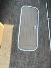Slide: The Image of 2019 Godfrey 259CBD boat deck with storage hatch. - 13