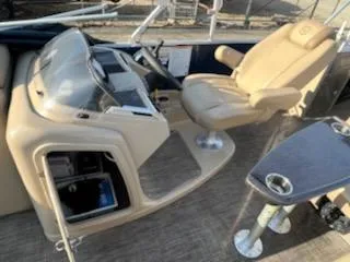 Slide: The Image of 2019 Godfrey 259CBD boat helm with captain's chair and control panel. - 14