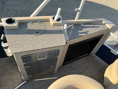 Slide: The Image of 2019 Godfrey 259CBD boat interior with kitchenette and storage. - 18