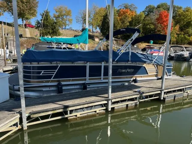 Slide: The Image of 2019 Godfrey 259CBD pontoon boat docked at marina with autumn trees in background. - 3