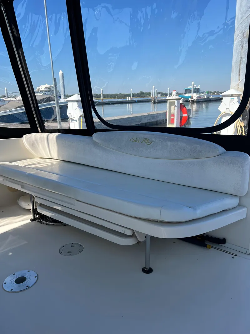 Slide: The Image of Interior view of 2000 Sea Ray 34 DA boat with white seating. - 19
