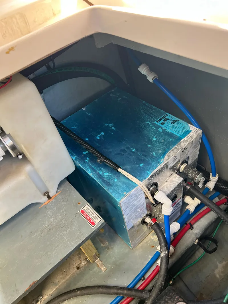 Slide: The Image of Engine compartment of 2000 Sea Ray 34 DA with wiring and components. - 21