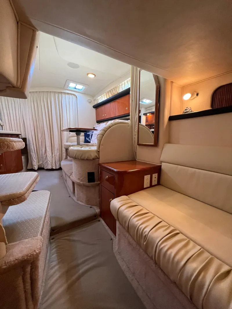 Slide: The Image of Interior of 2000 Sea Ray 34 DA yacht with cozy seating and elegant design. - 25