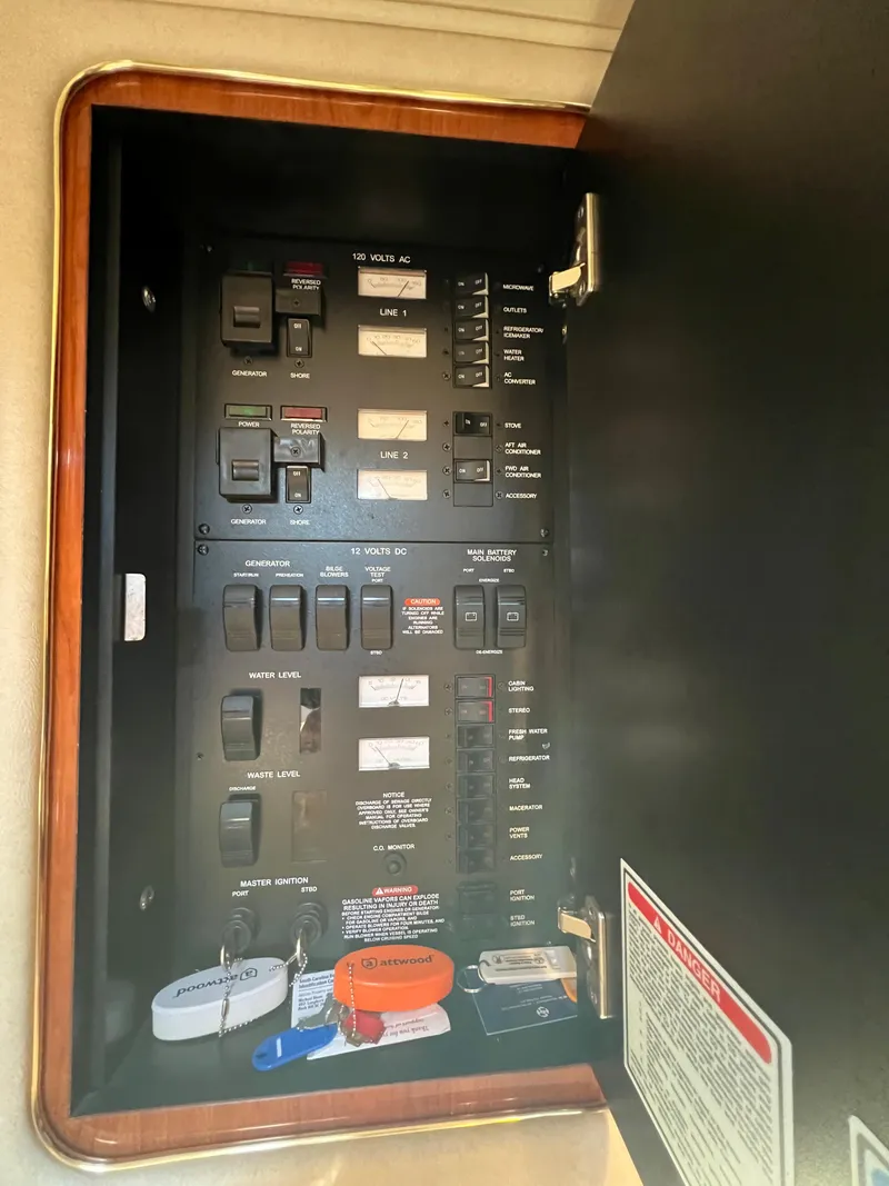 Slide: The Image of Electrical panel inside 2000 Sea Ray 34 DA boat, featuring various switches and labels. - 39