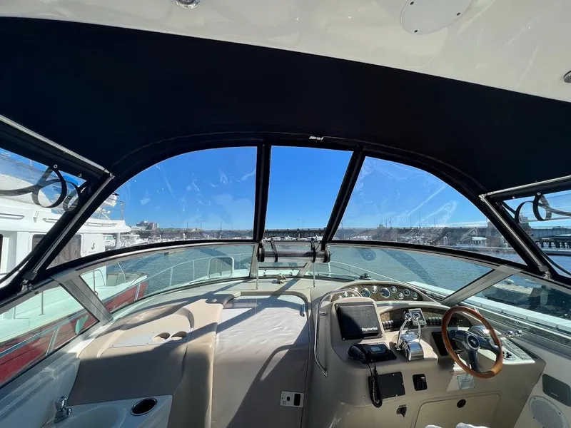 Slide: The Image of Interior view of 2000 Sea Ray 34 DA yacht cockpit with clear waterfront view. - 4