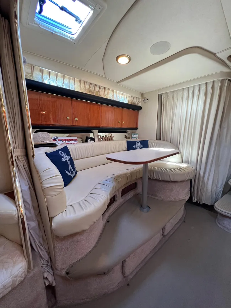 Slide: The Image of Interior of 2000 Sea Ray 34 DA yacht with plush seating and elegant decor. - 41