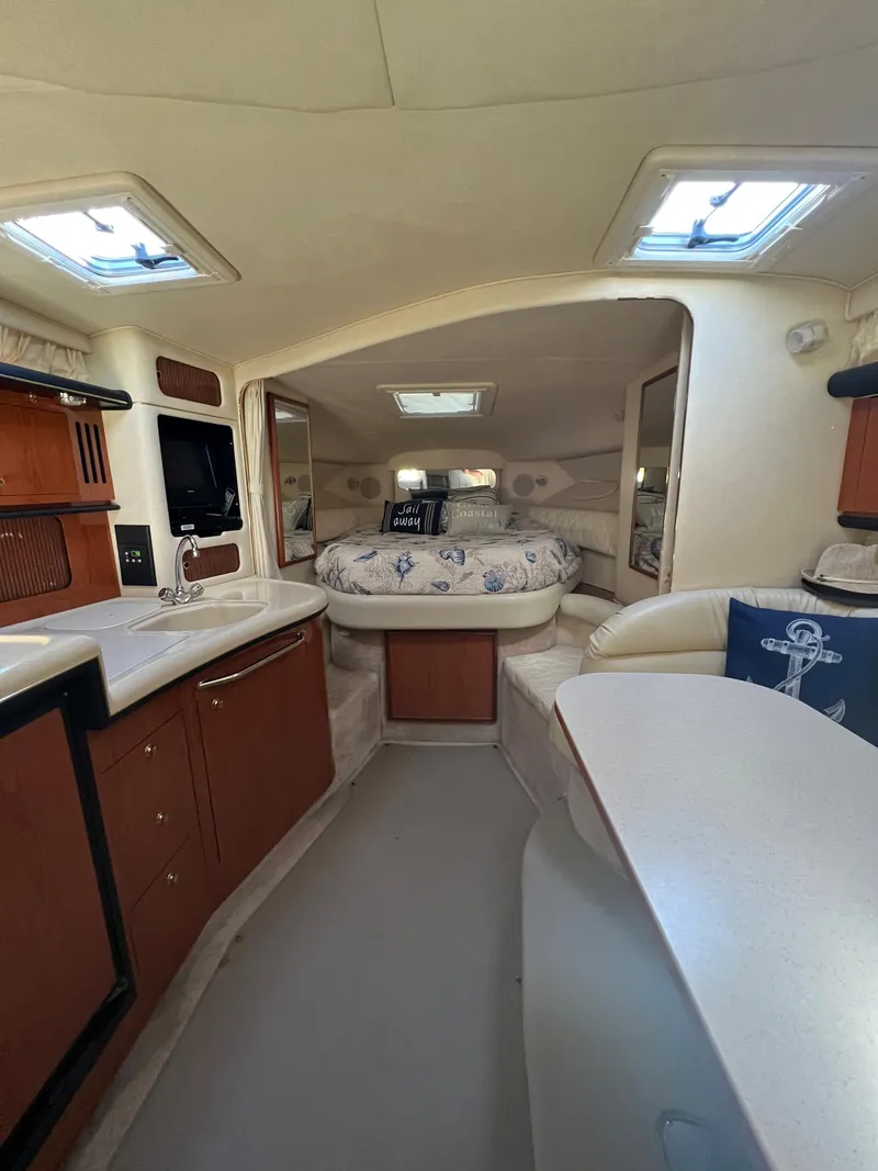 Slide: The Image of Interior of 2000 Sea Ray 34 DA yacht with cozy cabin and modern amenities. - 46