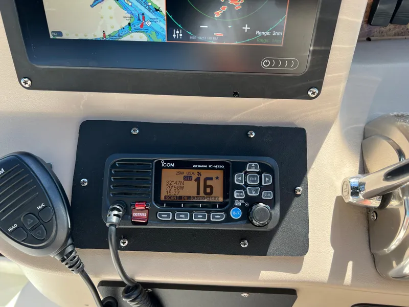 Slide: The Image of Control panel of a 2000 Sea Ray 34 DA boat with navigation and communication equipment. - 6