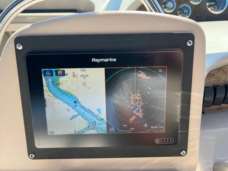 Slide: The Image of Raymarine navigation display on 2000 Sea Ray 34 DA boat dashboard. - 9