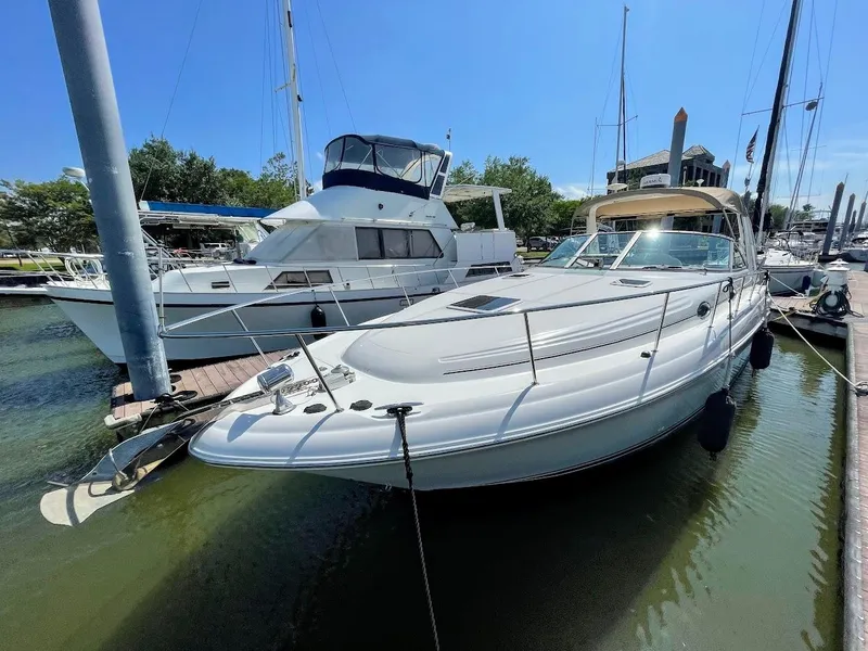 Slide: The Image of 2002 Sea Ray 340 Sundancer docked at marina on a sunny day. - 11