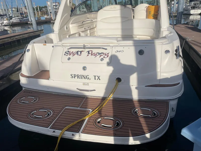Slide: The Image of 2002 Sea Ray 340 Sundancer boat docked in Spring, TX marina. - 2