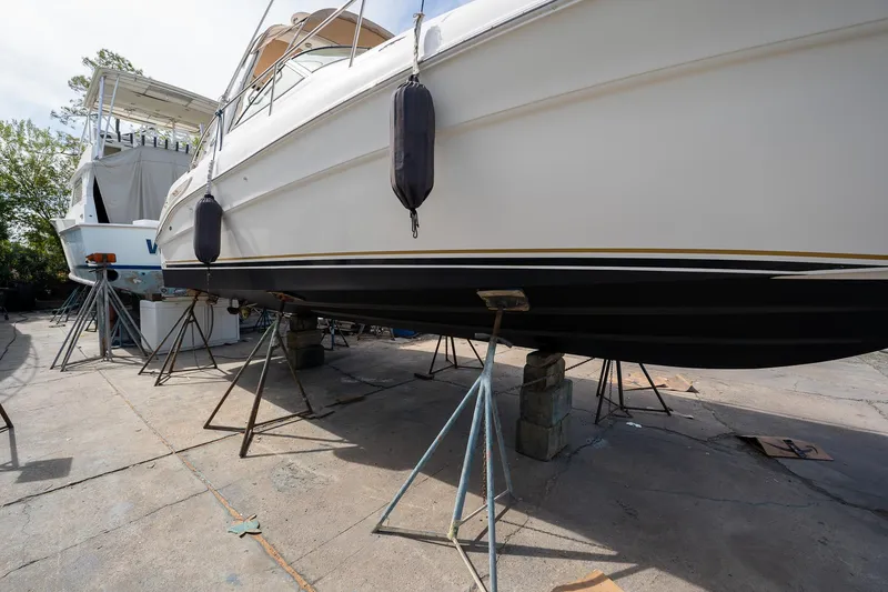 Slide: The Image of 2002 Sea Ray 340 Sundancer yacht on stands for maintenance. - 43