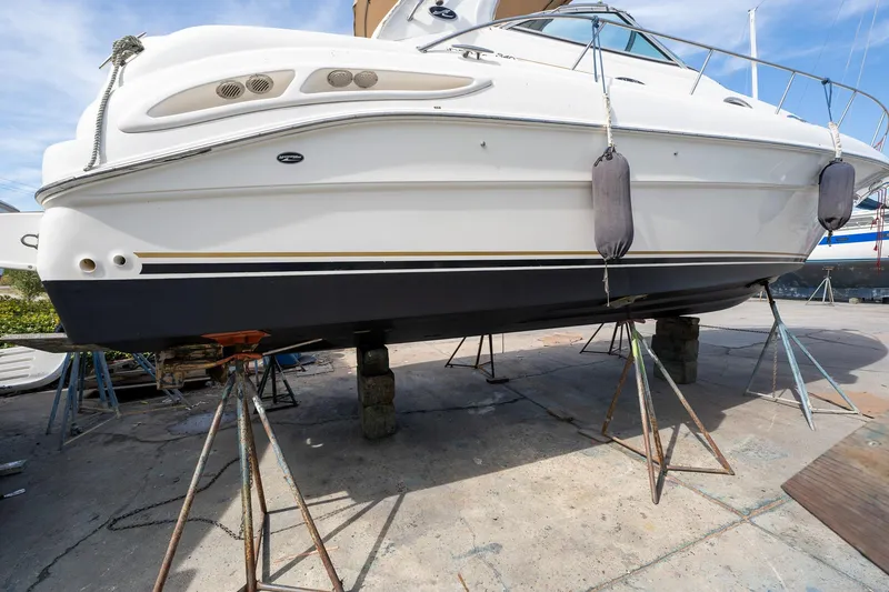 Slide: The Image of 2002 Sea Ray 340 Sundancer yacht on stands for maintenance. - 44