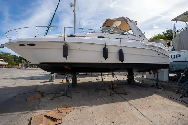 Slide: The Image of 2002 Sea Ray 340 Sundancer yacht on dry dock, side view. - 45