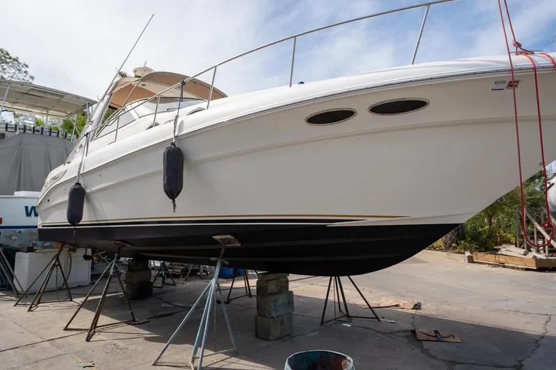 Slide: The Image of 2002 Sea Ray 340 Sundancer yacht on dry dock for maintenance. - 46