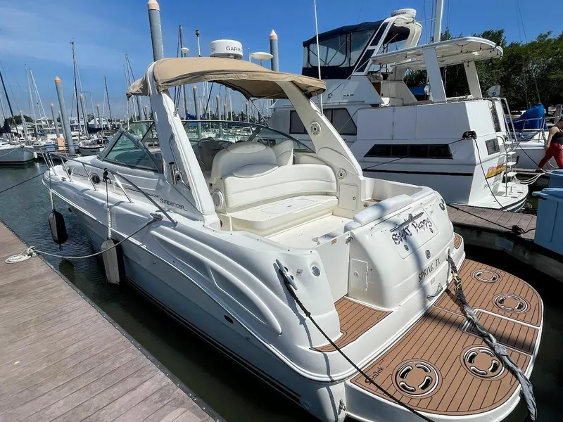 Slide: The Image of 2002 Sea Ray 340 Sundancer docked at a marina. - 6