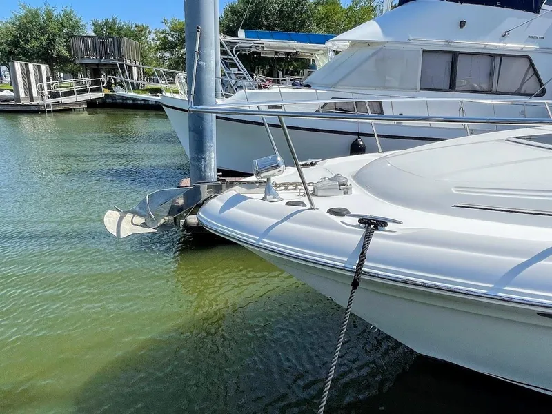 Slide: The Image of 2002 Sea Ray 340 Sundancer docked at a marina. - 9