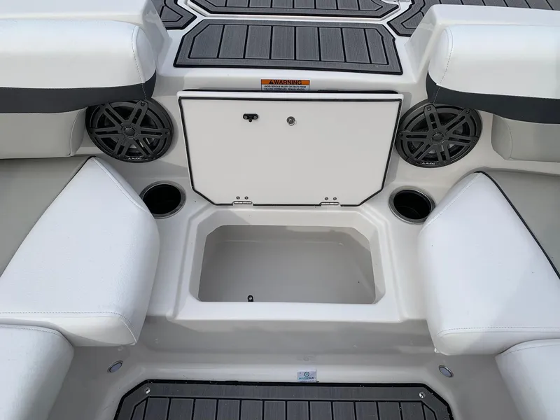 Slide: The Image of 2026 Starcraft SVX 190 boat interior with storage compartment and cup holders. - 10