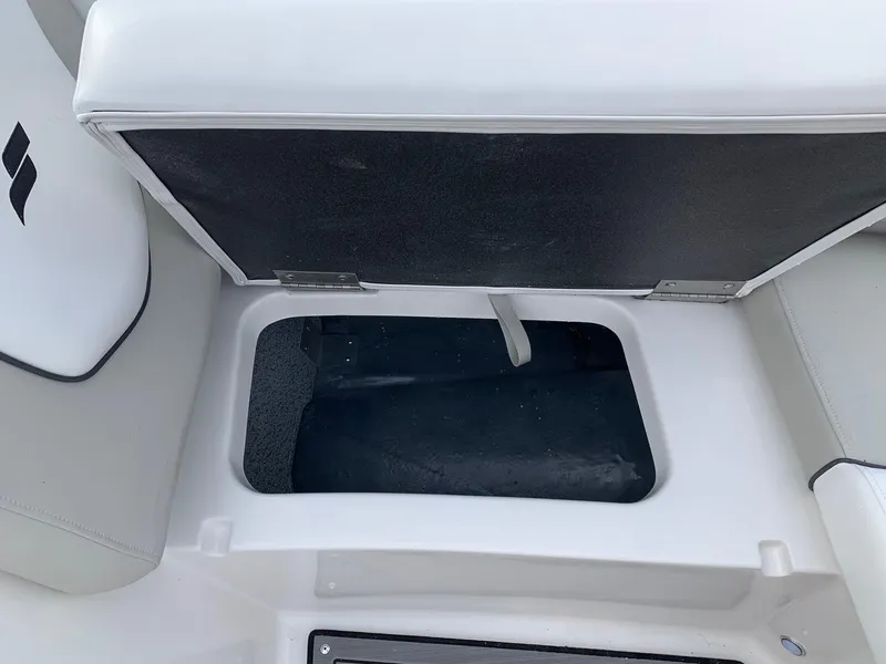Slide: The Image of Open storage compartment in 2026 Starcraft SVX 190 boat seat. - 11