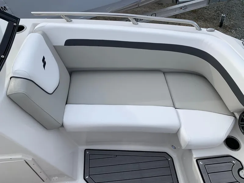 Slide: The Image of 2026 Starcraft SVX 190 boat interior with white cushioned seating and sleek design. - 12