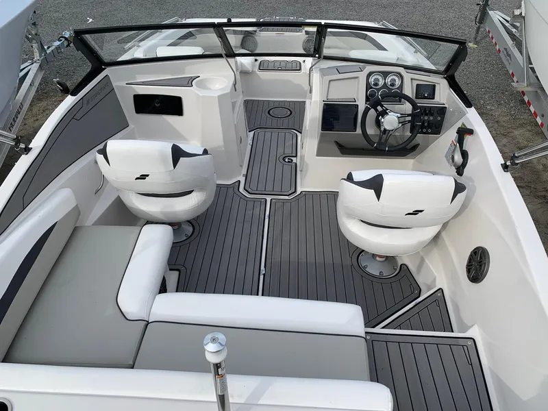Slide: The Image of 2026 Starcraft SVX 190 boat interior with modern seating and sleek dashboard design. - 16