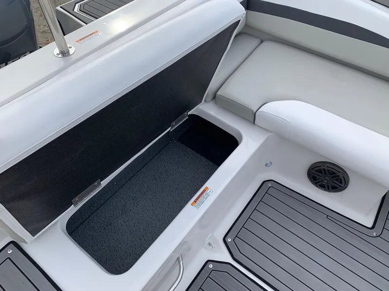 Slide: The Image of Interior view of 2026 Starcraft SVX 190 boat, featuring seating and storage compartment. - 4