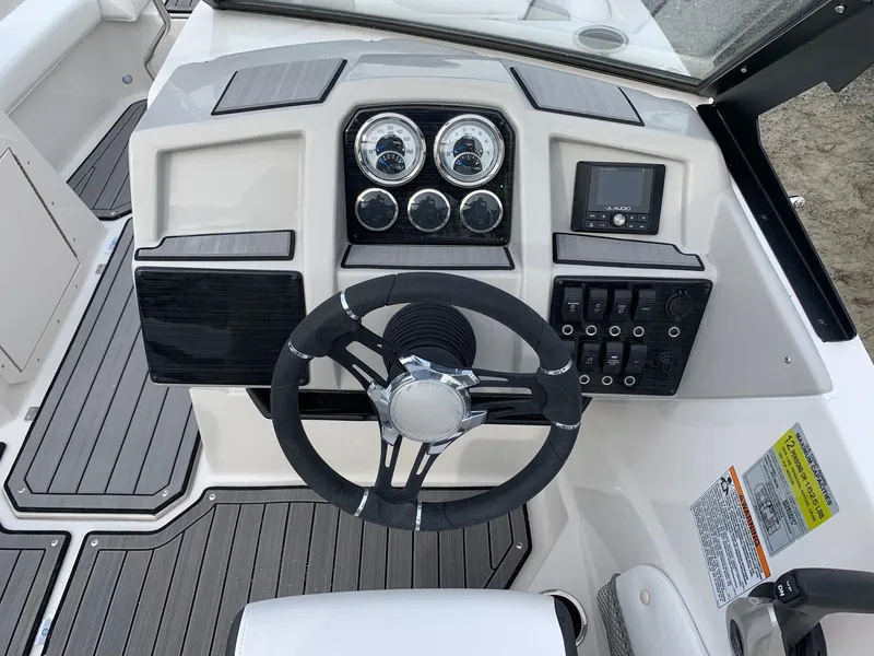 Slide: The Image of 2026 Starcraft SVX 190 boat dashboard with steering wheel and control panel. - 5