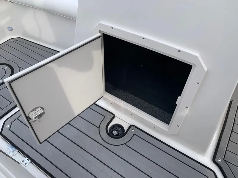Slide: The Image of Open storage compartment on 2026 Starcraft SVX 190 boat deck. - 7